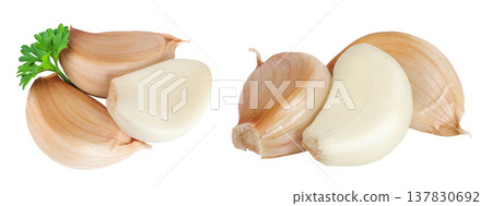 garlic cloves isolated on white background close up. Top view. Flat lay. garlic cloves isolated on white background close up. Top view. Flat lay. 137830692