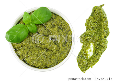 Pesto sauce in ceramic bowl isolated on white background. Top view. Flat lay. Pesto sauce in ceramic bowl isolated on white background. Top view. Flat lay. 137830717