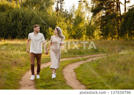 Serene Family Walk Amidst Tall Grasses And Distant Trees Capturing Heartfelt Moments Serene Family Walk Amidst Tall Grasses And Distant Trees Capturing Heartfelt Moments 137830796