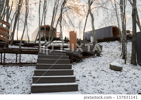 Chilly wooden staircase ascends into tranquil woodland hideaway Chilly wooden staircase ascends into tranquil woodland hideaway 137831141