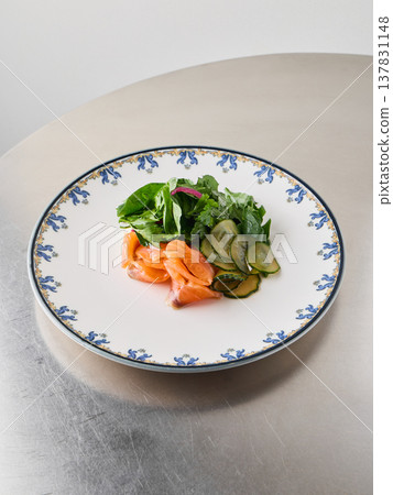 Delicious smoked salmon salad with crisp cucumber and fresh greens Delicious smoked salmon salad with crisp cucumber and fresh greens 137831148