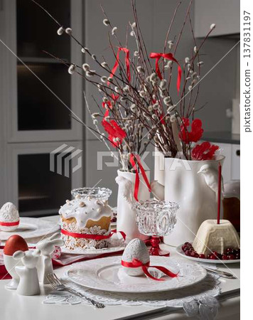 Decorative branches with ribbons surrounding cake and utensil setup Decorative branches with ribbons surrounding cake and utensil setup 137831197