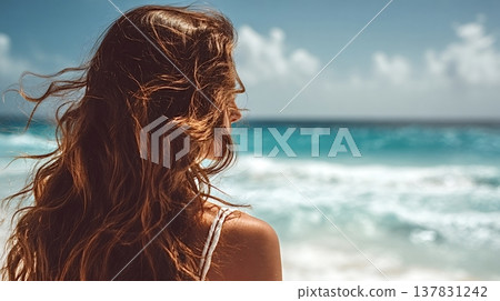 Woman admiring ocean view contemplating beach vacation Woman admiring ocean view contemplating beach vacation 137831242