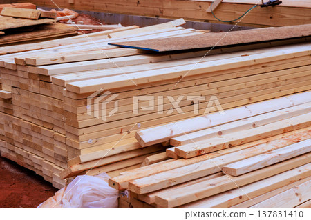 Wood stacked on construction site ready for building work new home project Wood stacked on construction site ready for building work new home project 137831410