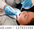 Asian child visiting dentist for oral checkup with dental tools in use 137831584