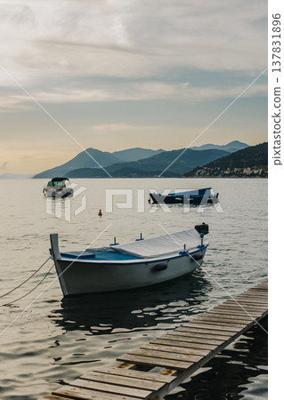 Beautiful boat in the sea near Dubrovnik city on a sunset. Beautiful boat in the sea near Dubrovnik city on a sunset. 137831896