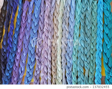 Many colorful threads braided together: blue and purple 137832455