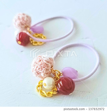 Handmade kids' hair ties with lots of colorful beads and tweed fabric ball charms. 137832972