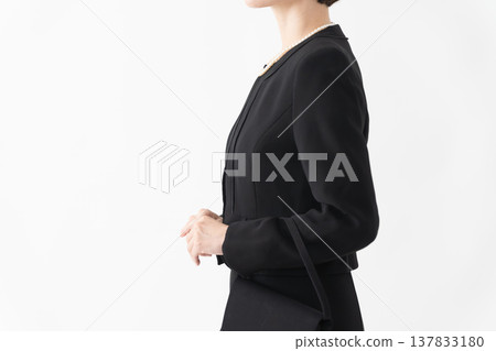 Woman in mourning clothes Funeral image 137833180