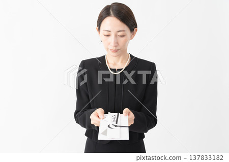 Woman in mourning clothes Funeral image Woman in mourning clothes Funeral image 137833182