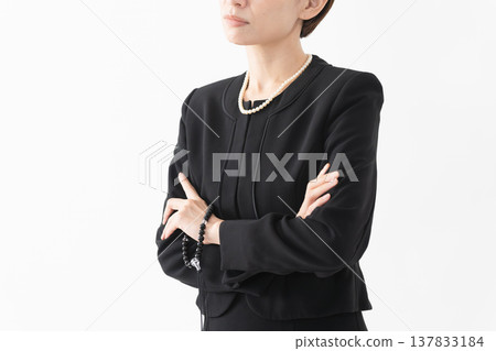 Woman in mourning clothes Funeral image 137833184