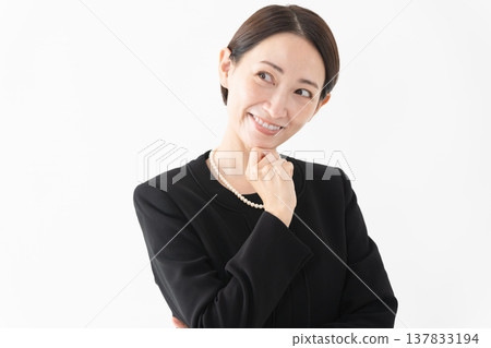 Woman in mourning clothes Funeral image 137833194