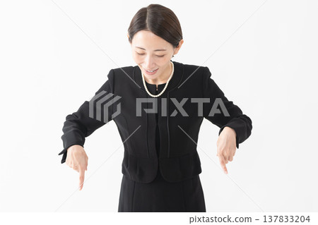 Woman in mourning clothes Funeral image 137833204