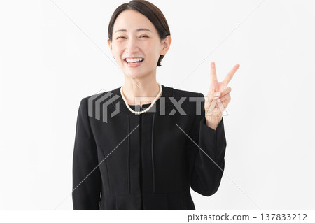 Woman in mourning clothes Funeral image 137833212