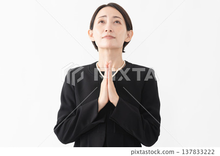 Woman in mourning clothes Funeral image 137833222