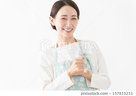 Woman wearing an apron Lifestyle image 137833231