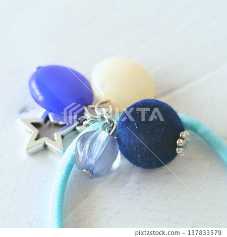 Handmade kids' hair tie with lots of colorful beads and a velvet ball charm. 137833579