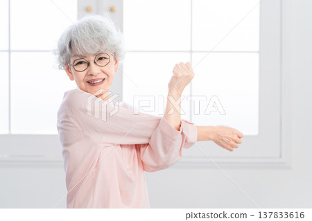 Senior woman stretching Senior woman stretching 137833616