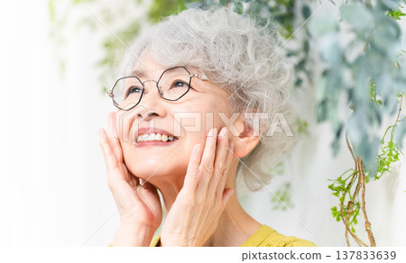 Senior woman wearing a yellow dress Senior woman wearing a yellow dress 137833639