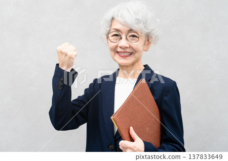 Senior woman in a business suit Business image Senior woman in a business suit Business image 137833649