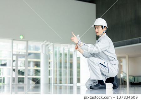 Male worker holding a tablet Male worker holding a tablet 137834609