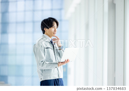 Engineer working in a modern office Engineer working in a modern office 137834683