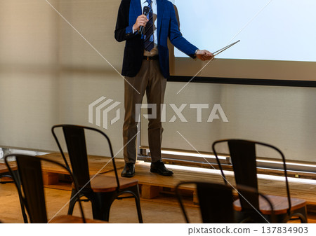 The presenter explains using a pointer. 137834903