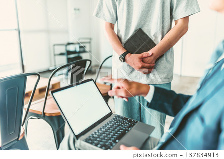 A professor instructing students using a PC. A professor instructing students using a PC. 137834913