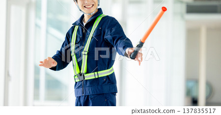 Traffic controller directing traffic 137835517