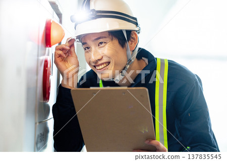 A man conducting a fire safety inspection A man conducting a fire safety inspection 137835545