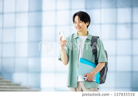 A man with a smartphone A man with a smartphone 137835558