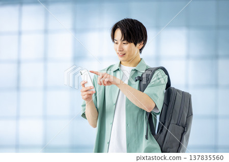 A man with a smartphone A man with a smartphone 137835560