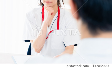 Healthcare worker explaining to patient Healthcare worker explaining to patient 137835884