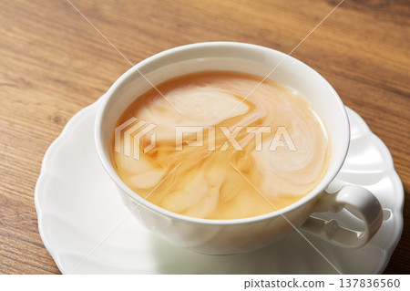Adding milk to tea Adding milk to tea 137836560