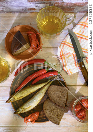 Still life with beer, crayfish, bread and salted fish 137836588