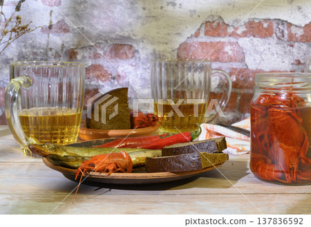 Still life with beer, crayfish, bread and salted fish 137836592