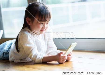 Girls using smartphones Girls using smartphones 137836826