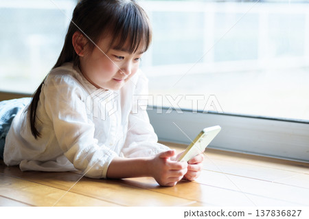 Girls using smartphones Girls using smartphones 137836827