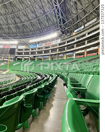 Empty professional baseball stadium stands: A large dome space with beautiful depth and curves | Copy space, advertising material, commercial use Empty professional baseball stadium stands: A large dome space with beautiful depth and curves | Copy space, advertising material, commercial use 137837320