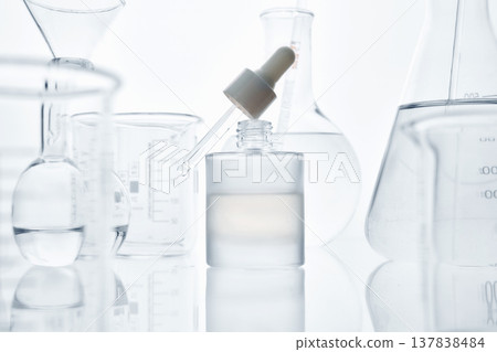 Developing cosmetic product serum at laboratory bench Developing cosmetic product serum at laboratory bench 137838484