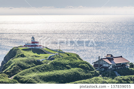 Otaru City, Hokkaido: Hiyoriyama Lighthouse and Herring Mansion illuminated by the sparkling sea. Otaru City, Hokkaido: Hiyoriyama Lighthouse and Herring Mansion illuminated by the sparkling sea. 137839055