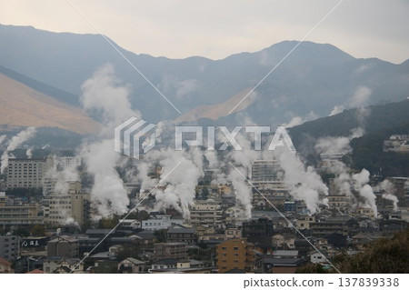 Steam rising from Kannawa Onsen and the hot spring town on a rainy day in March. Steam rising from Kannawa Onsen and the hot spring town on a rainy day in March. 137839338