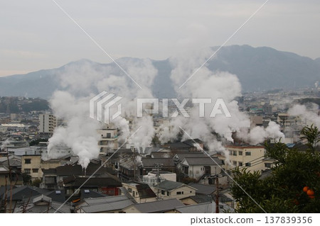 Steam rising from Kannawa Onsen and the hot spring town on a rainy day in March. Steam rising from Kannawa Onsen and the hot spring town on a rainy day in March. 137839356