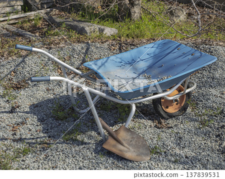 My gardening companions: a blue wheelbarrow and a shovel. My gardening companions: a blue wheelbarrow and a shovel. 137839531