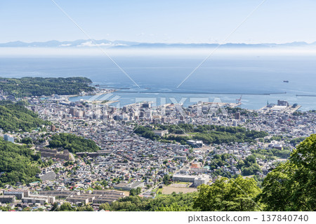 Otaru City, Hokkaido: Summer in Hokkaido - A view of the popular tourist destination, Otaru, from Mount Tengu. Otaru City, Hokkaido: Summer in Hokkaido - A view of the popular tourist destination, Otaru, from Mount Tengu. 137840740