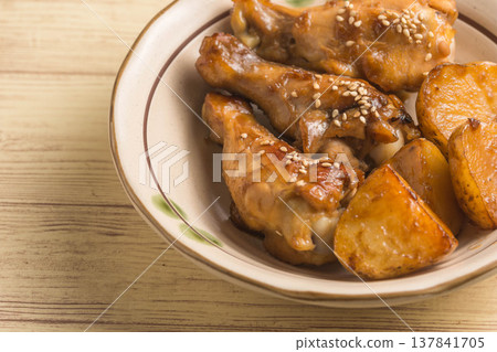 Teriyaki chicken wings and potatoes 137841705