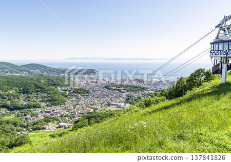 Otaru City, Hokkaido: Summer in Hokkaido - A view of the popular tourist destination, Otaru, from Mount Tengu. Otaru City, Hokkaido: Summer in Hokkaido - A view of the popular tourist destination, Otaru, from Mount Tengu. 137841826