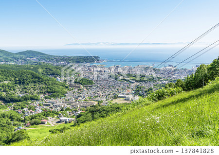 Otaru City, Hokkaido: Summer in Hokkaido - A view of the popular tourist destination, Otaru, from Mount Tengu. Otaru City, Hokkaido: Summer in Hokkaido - A view of the popular tourist destination, Otaru, from Mount Tengu. 137841828