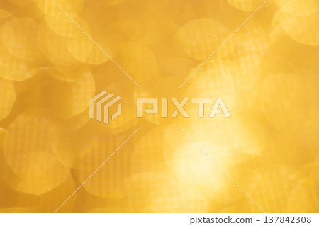 Gold-colored glitter background material 137842308