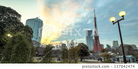 Shiba Park and the city skyline at dusk, with Tokyo Tower and Zojoji Temple in the background. 137842474